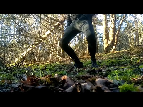 Twink strokes his bulge and cums in the woods