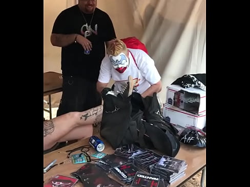 FlipFlop The Clown worshipping a woman's dirty and muddy shoe at the 2017 Gathering of the Juggalos
