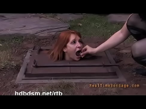 A cute redhead gets covered with mud and piss outdoor