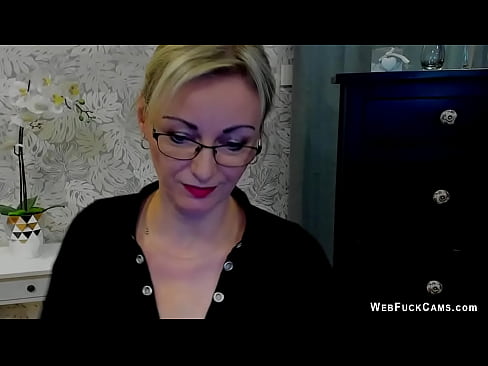 Blonde German amateur MILF LUXvanessa with glasses in big cleavage black blouse flashing her natural big tits then posing in mini skirt