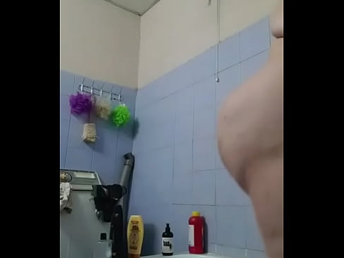 An Egyptian woman in the bathroom, completely naked