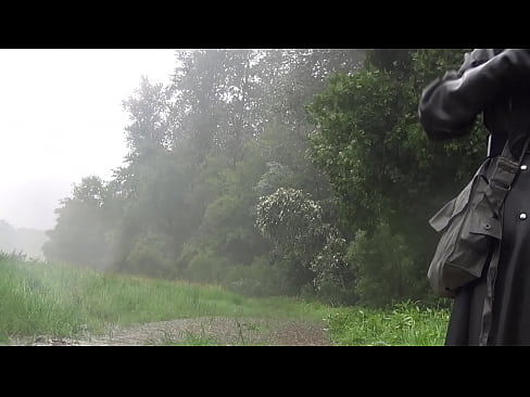 Heavy Rubber Raincoat and Rubbergloves in the Rain