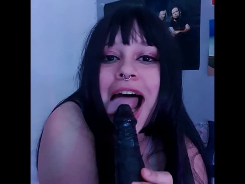 brunette sucking her dildo