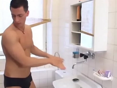 Muscled stud gets fucked bareback in bathroom
