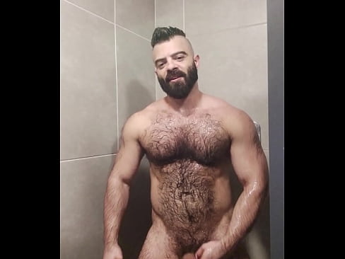 Furry sweat bear taking a shower after training.