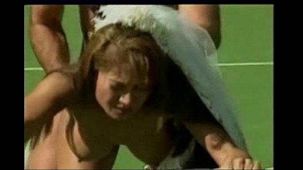 Asian bride on a tennis court