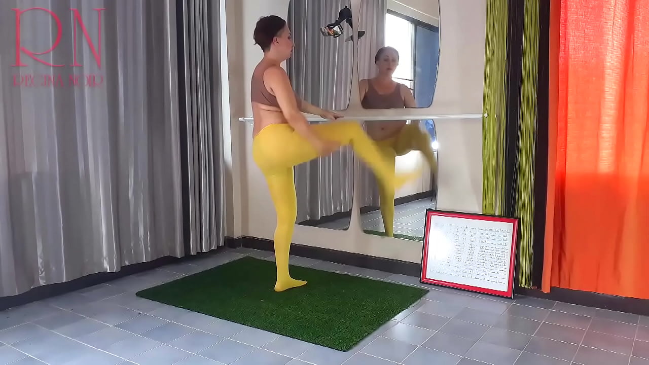 Regina Noir. Yoga in yellow tights doing yoga in the gym. 4