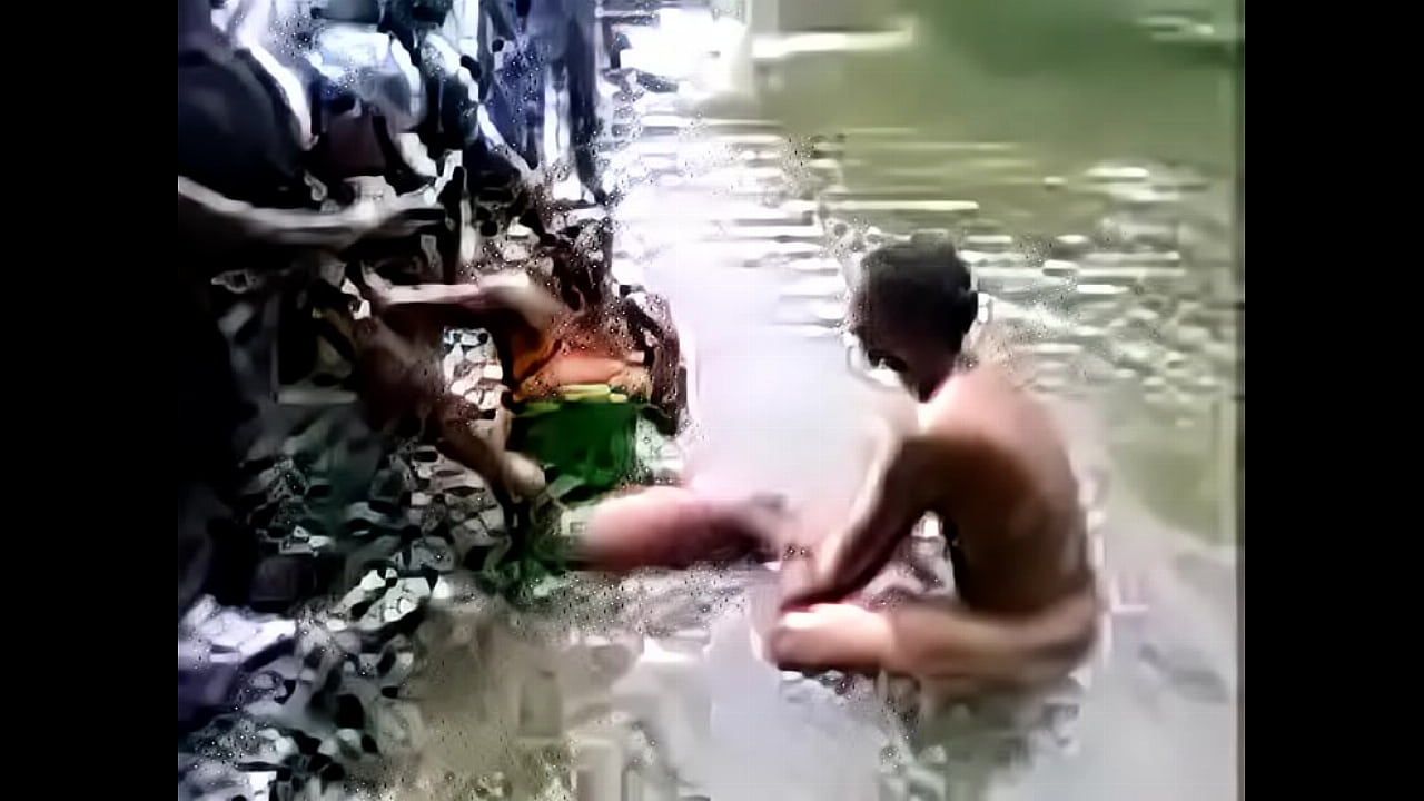 Indian people bathing in a river