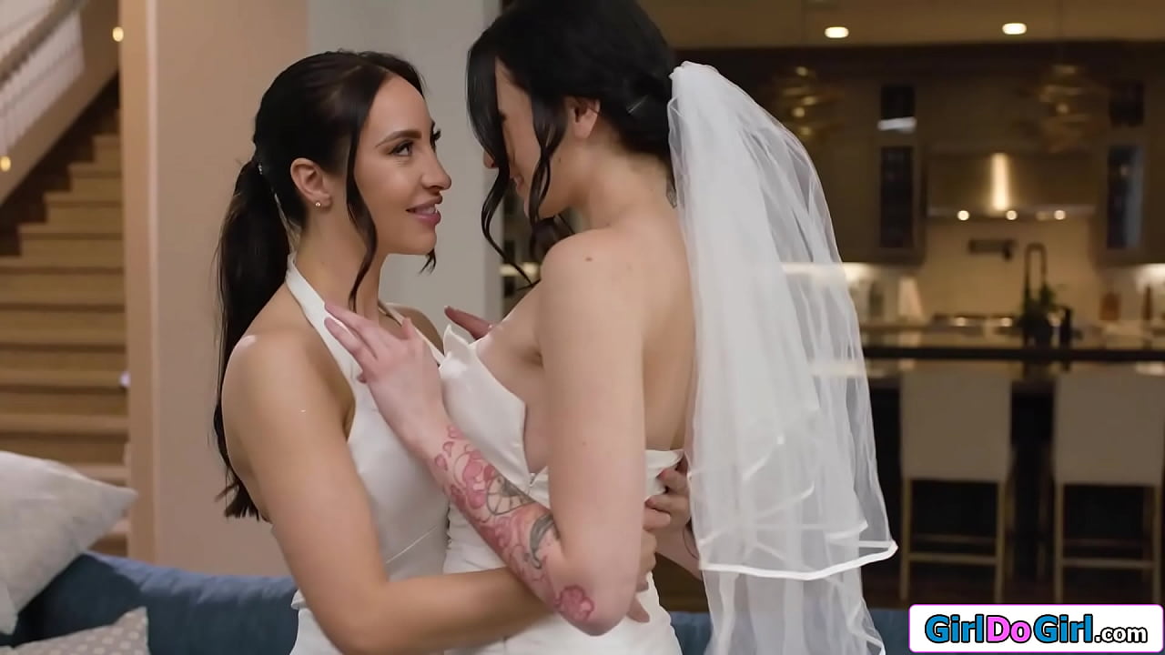 Lesbian brides Charlotte Sins and Melissa Stratton slow dance and Melissa starts to undress her busty wife.The big tits brunette licks her wifes pussy