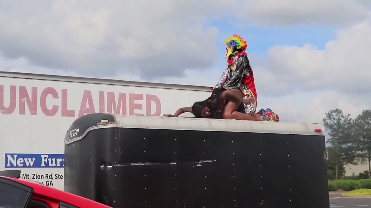 Gibby the clown fucks Ebony pornstar on top of trailer