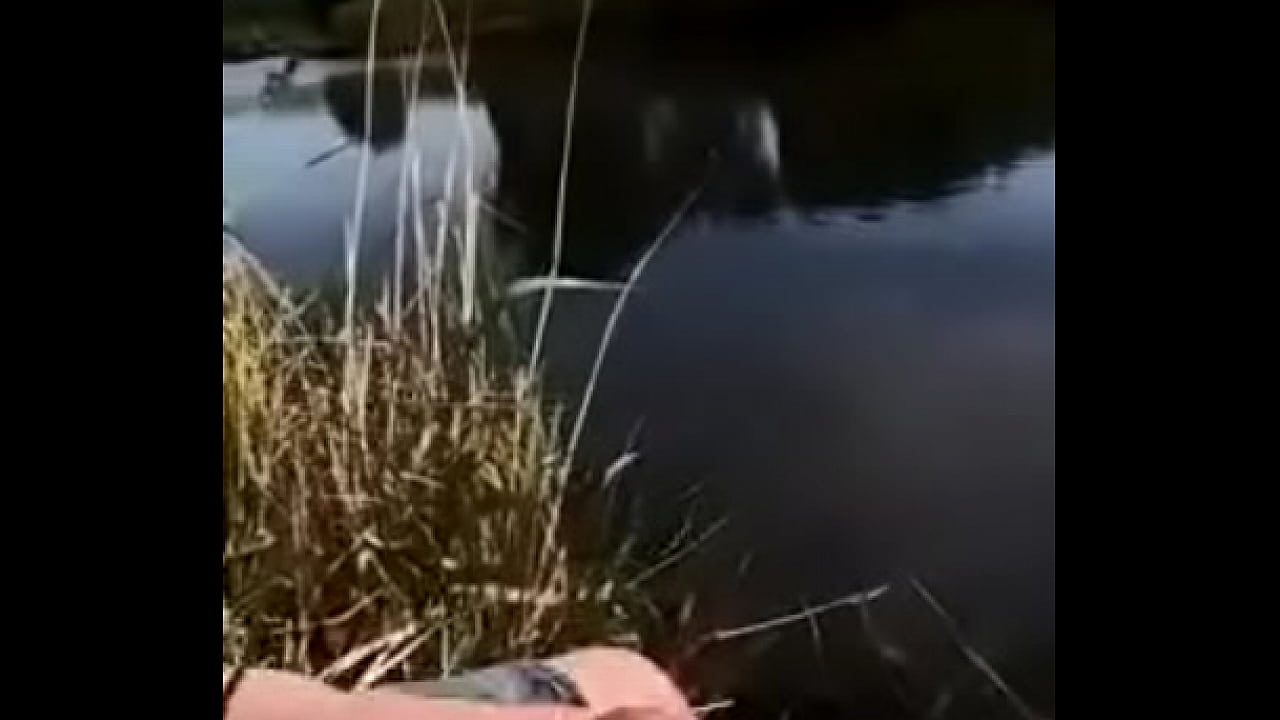 cute guy shooting his load into a river