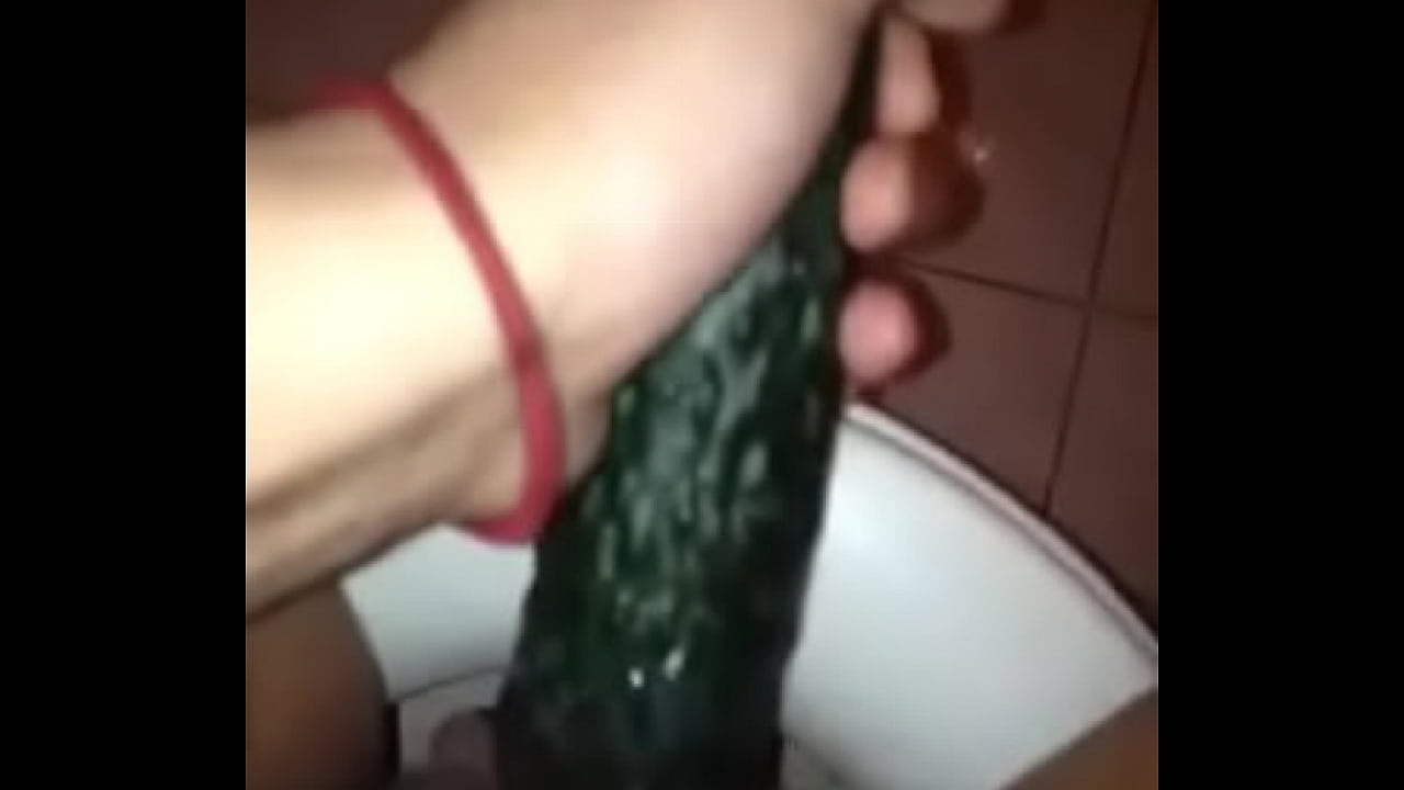 girl masturbathing with cucumber
