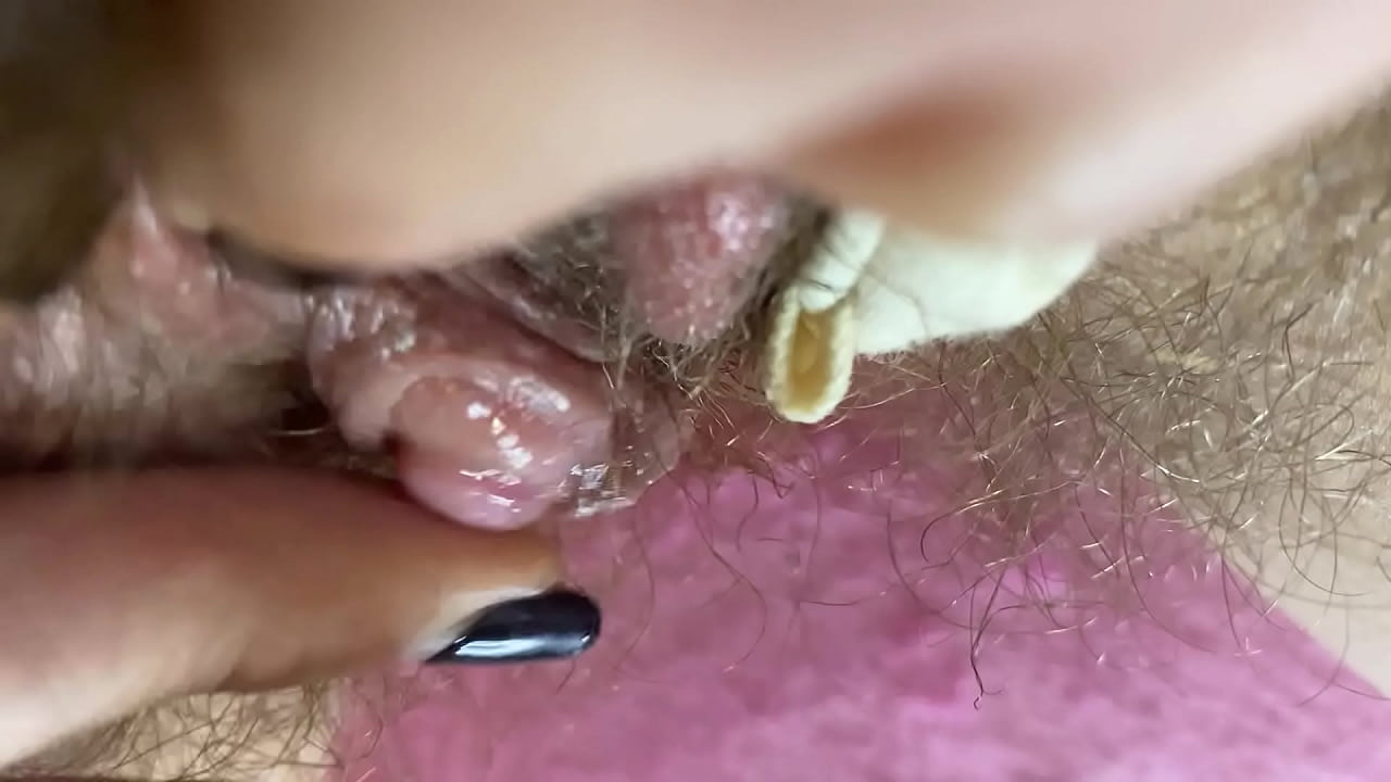 Closeup hairy cunt cums hard with erected clitoris