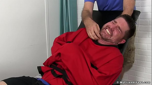 Handsome hunk tickled by an older guy