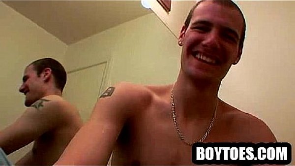 Horny stud shows off his feet and tugs on his cock 