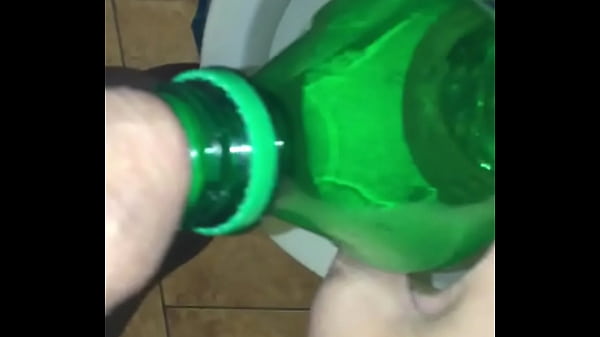 pissing in sprite bottole then pours warm pee on cock wipes wet dick on the wall