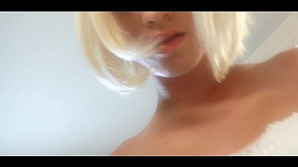 Blonde in sexy lingerie playing solo striptease