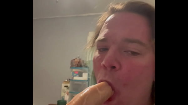 Scarlet gaging on a dildo  