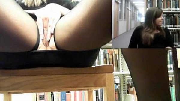 Horny slut masturbating in the library