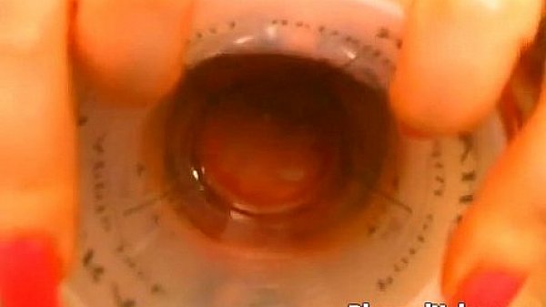 Busty MILF plays with her pierced cunt