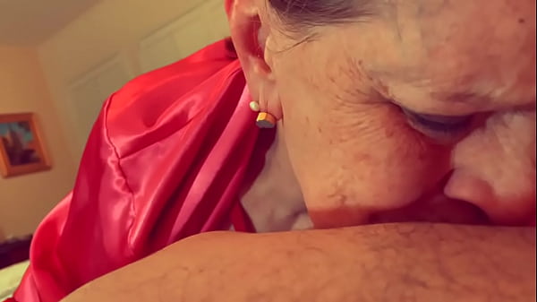 Mature granny in red sucks cock