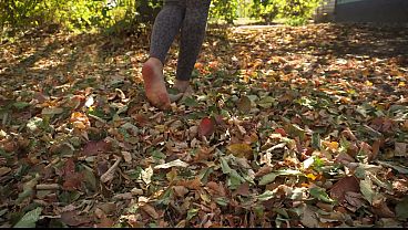 Sexy Feet With Long Toes Crushing Leves Outdoors