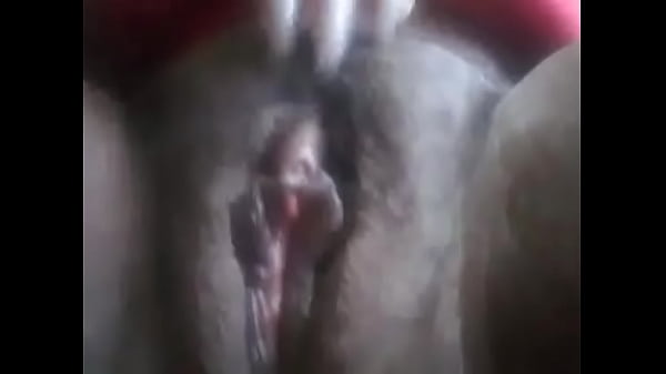Black bitch playing with her hairy pussy