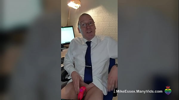 Mike Essex playing with a dildo in the office whilst locked in chastity 