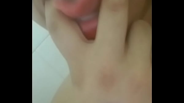 Latina sucks on her fingers in red lipstick