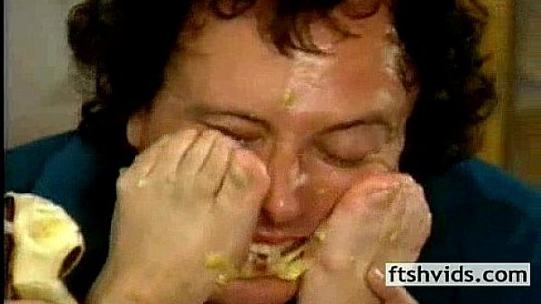 Eating banana of women's feet