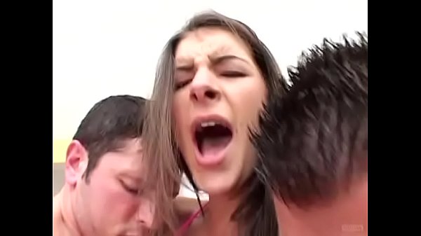 This cute brunette babe can easily manipulate those two big schloengs with her fuck holes