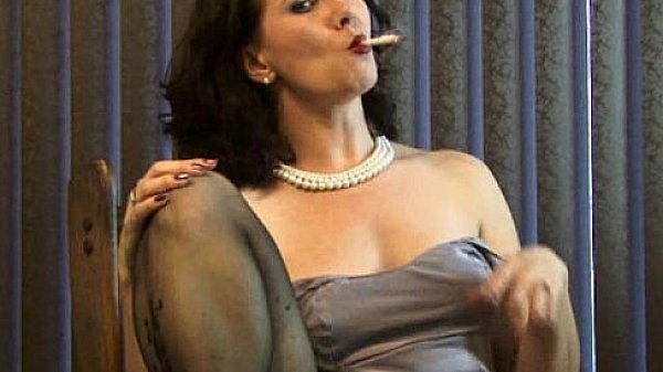 Sexy MILF puffs on a cigarette