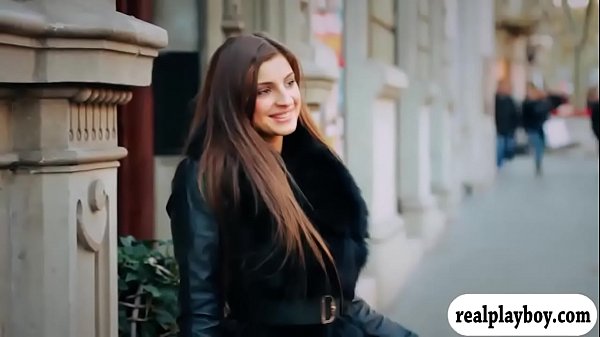 Pretty brunette babe moans as she finger fucks her shaved coochie on the couch 