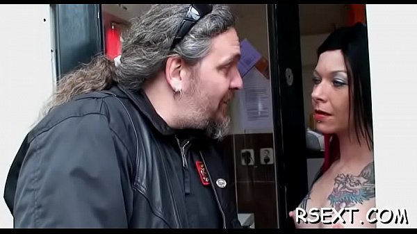 Tattooed mature gives oral-sex