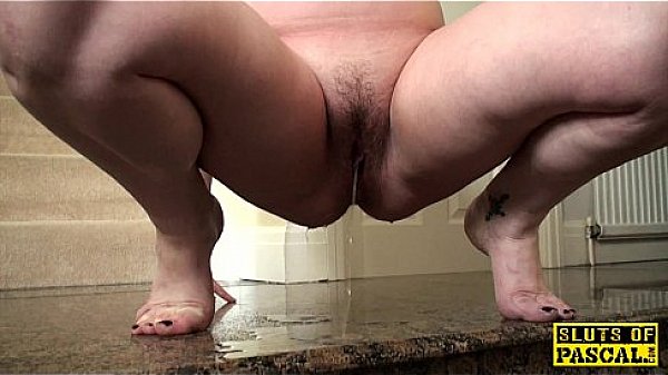 Pissing uk slut squats and wets the floor