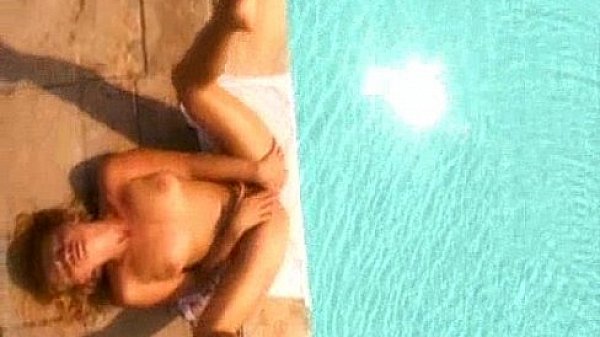 Sexy girl masturbates by the pool  