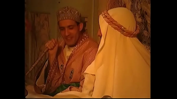 Belly dancers entertain a trio of Arabs in a tent for some mixed-combo, big dick action in this sequence.