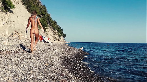 Russian young nudist girl Sasha Bikeyeva fucks on a nude beach
