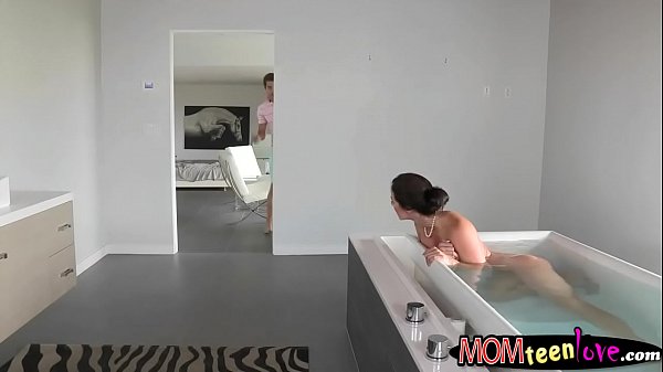 Stepson fucks his stepmom and his girlfriend on the bed