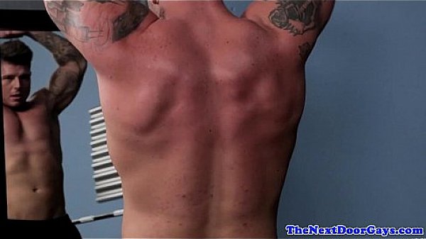 Tattooed hunk masturbates during workout