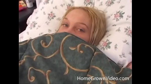 Naughty blonde with small tits rubs her shaved pussy  