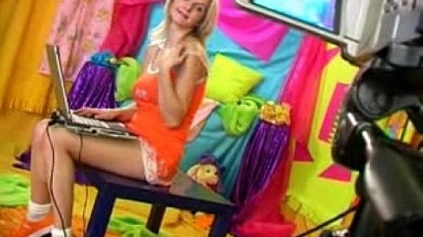 Blonde plays in front of camera 