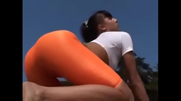 Sexy Girl In Orange Spandex Shorts