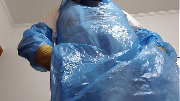 A cumshot on the glove, wearing a stinky jumpsuit and stinky rubber boots  