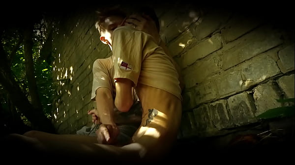 two young gays have fun in a hangar  