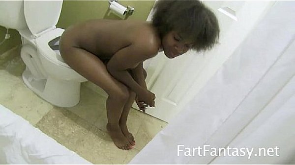 Black slut farts into toilette  