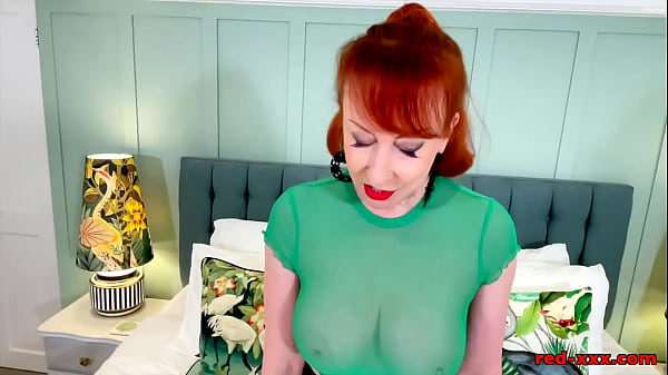 Insatiable redhead MILF teases then fucks herself with a glass dildo