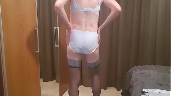 Man parades around in a Blue lingerie set and masturbates on it.