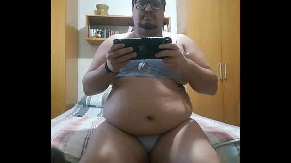 chubby boy playing nintendo switch 