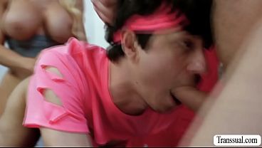 Busty shemale is in the gym with this two dude.After that,they start sucking each others hard big cock